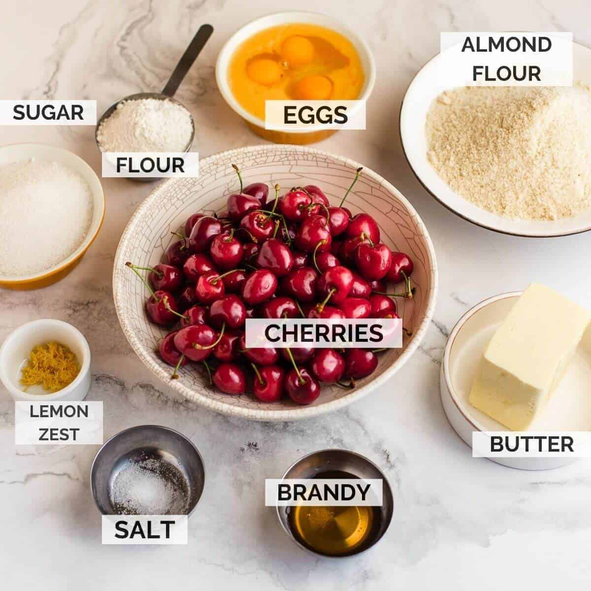 Ingredients in bowls on marble background.