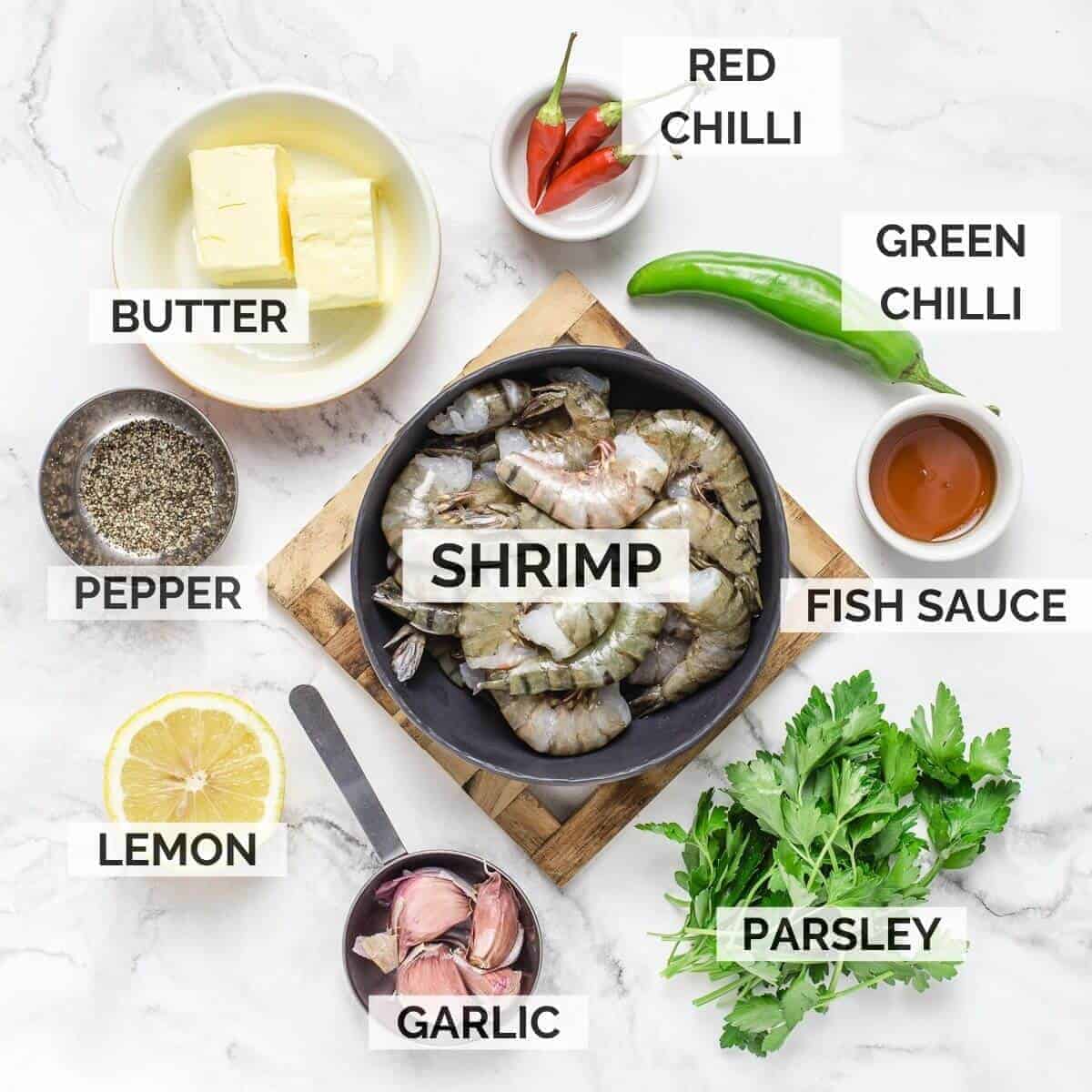 ingredients for making this recipe. butter, chilli red, chilli green, parsley, shrimps, pepper, lemon, garlic, fish sauce