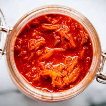 Kimchi in a glass vessel.