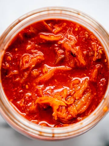 Kimchi in a glass vessel.