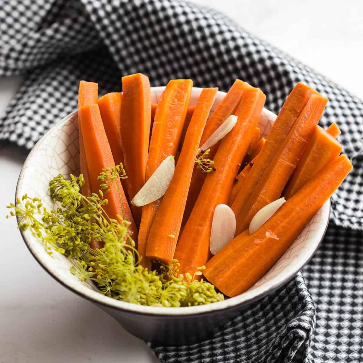 Lacto fermented carrots in bowl.