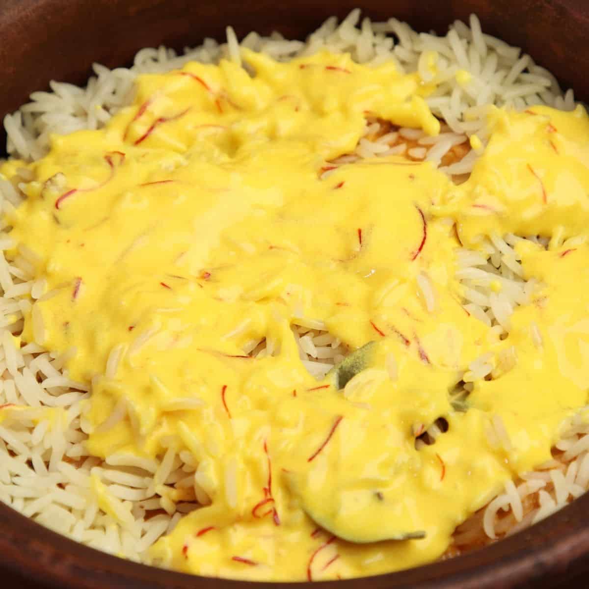 Layer of saffron sauce on rice.