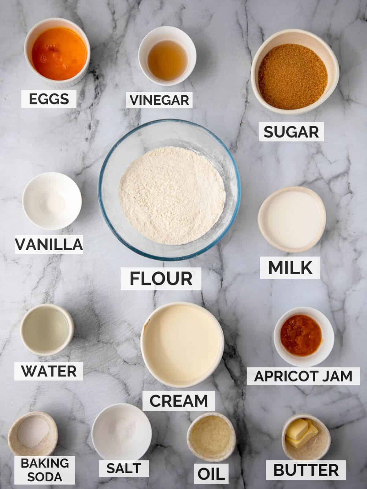 Ingredients for malva pudding on a marble surface.