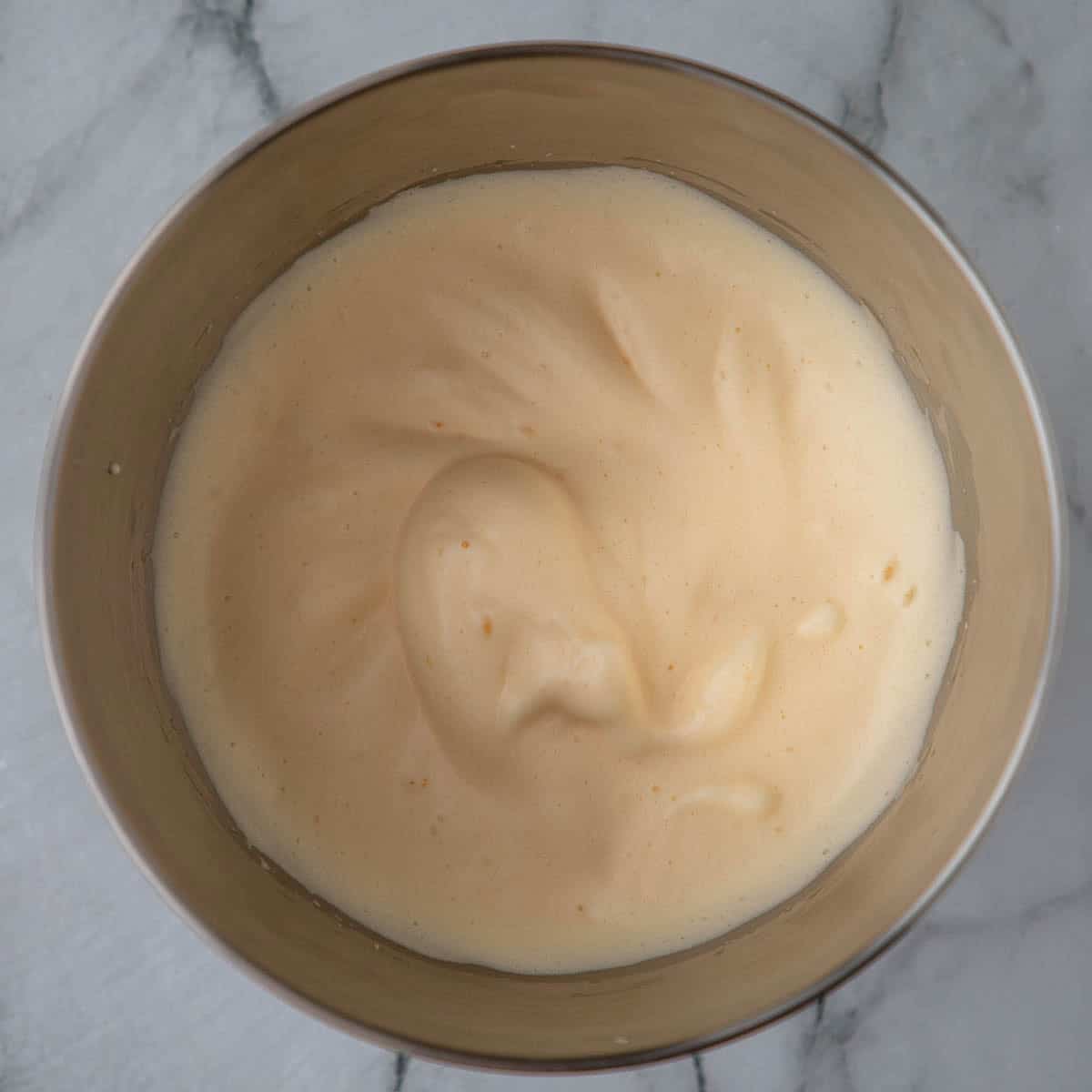Whipped eggs in a bowl.