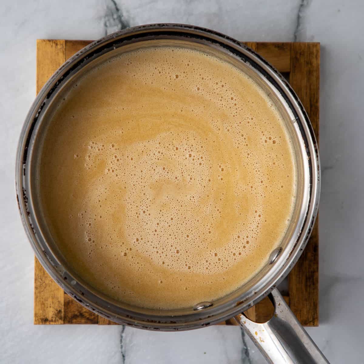 Creamy sauce in a sauce pan.