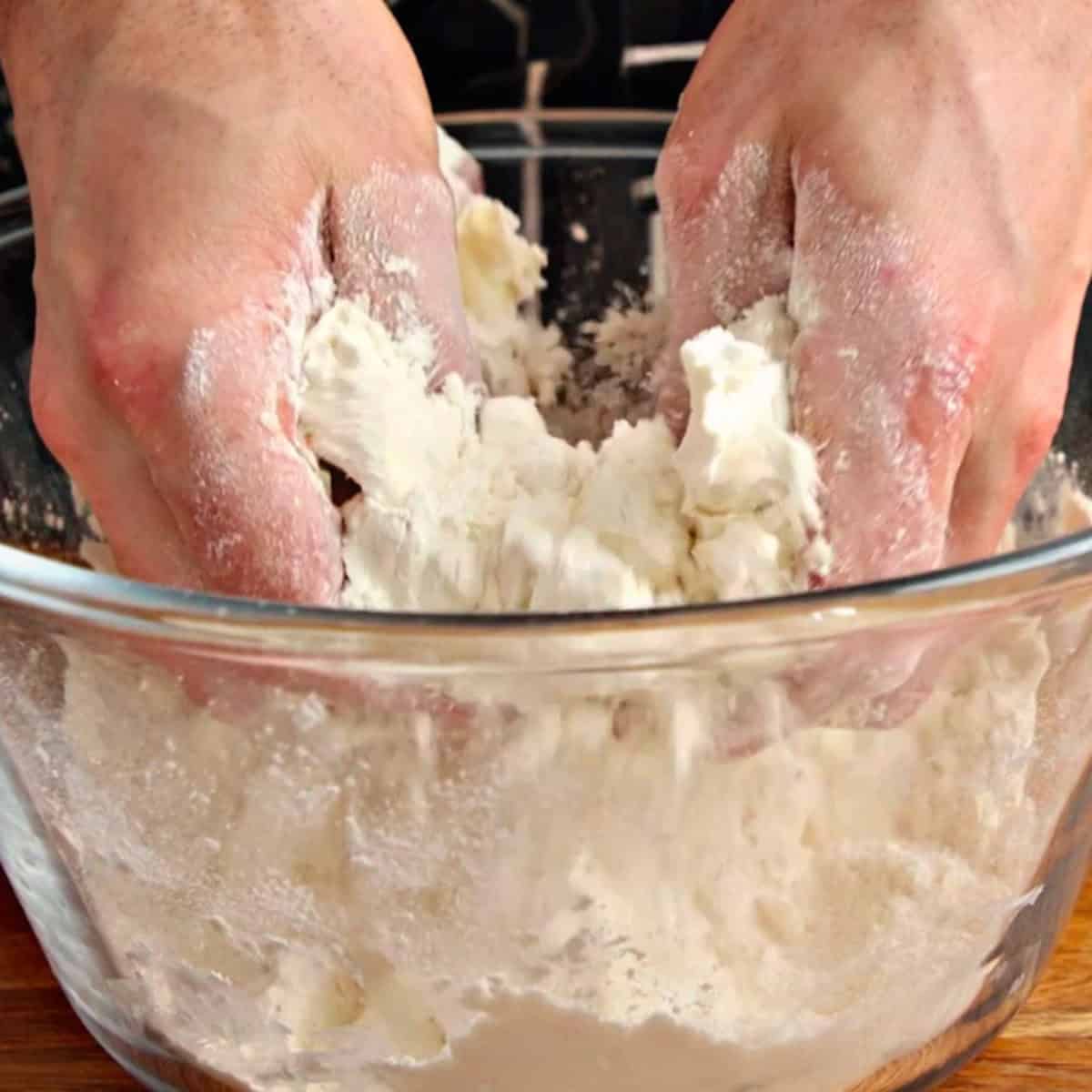 Mixing pastry by hand.