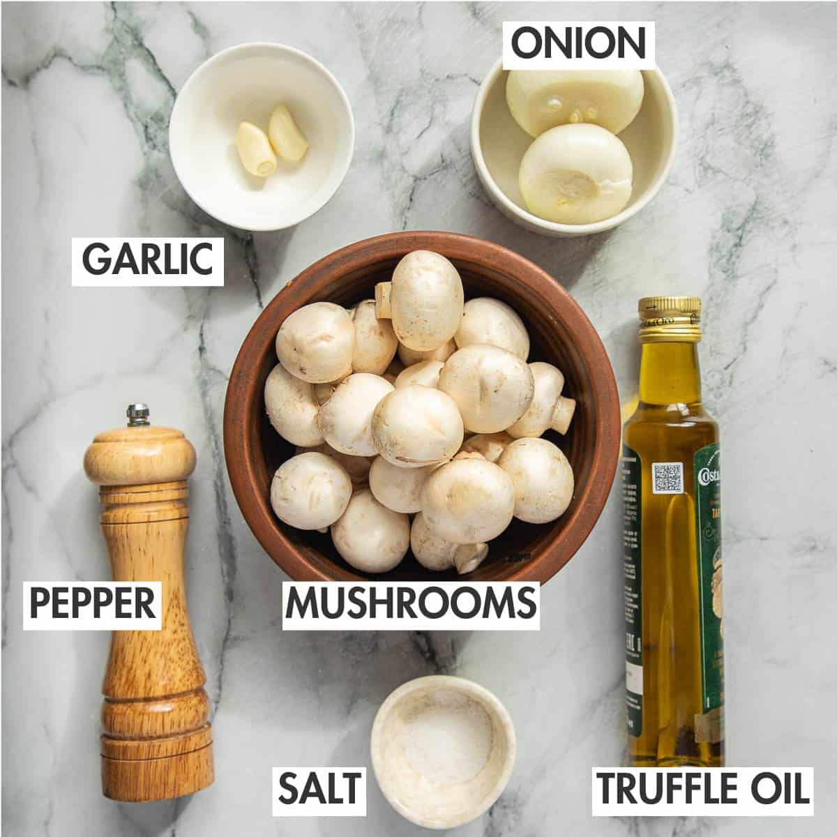 Mushroom pelmeni ingredients on a marble board.