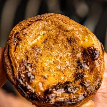 Pastel de nata sprinkled with cinnamon.