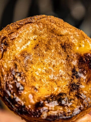 Pastel de nata sprinkled with cinnamon.