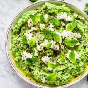 green pea and mint dip on white plate