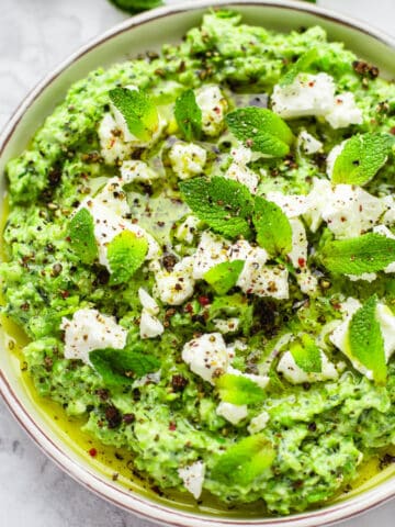 green pea and mint dip on white plate