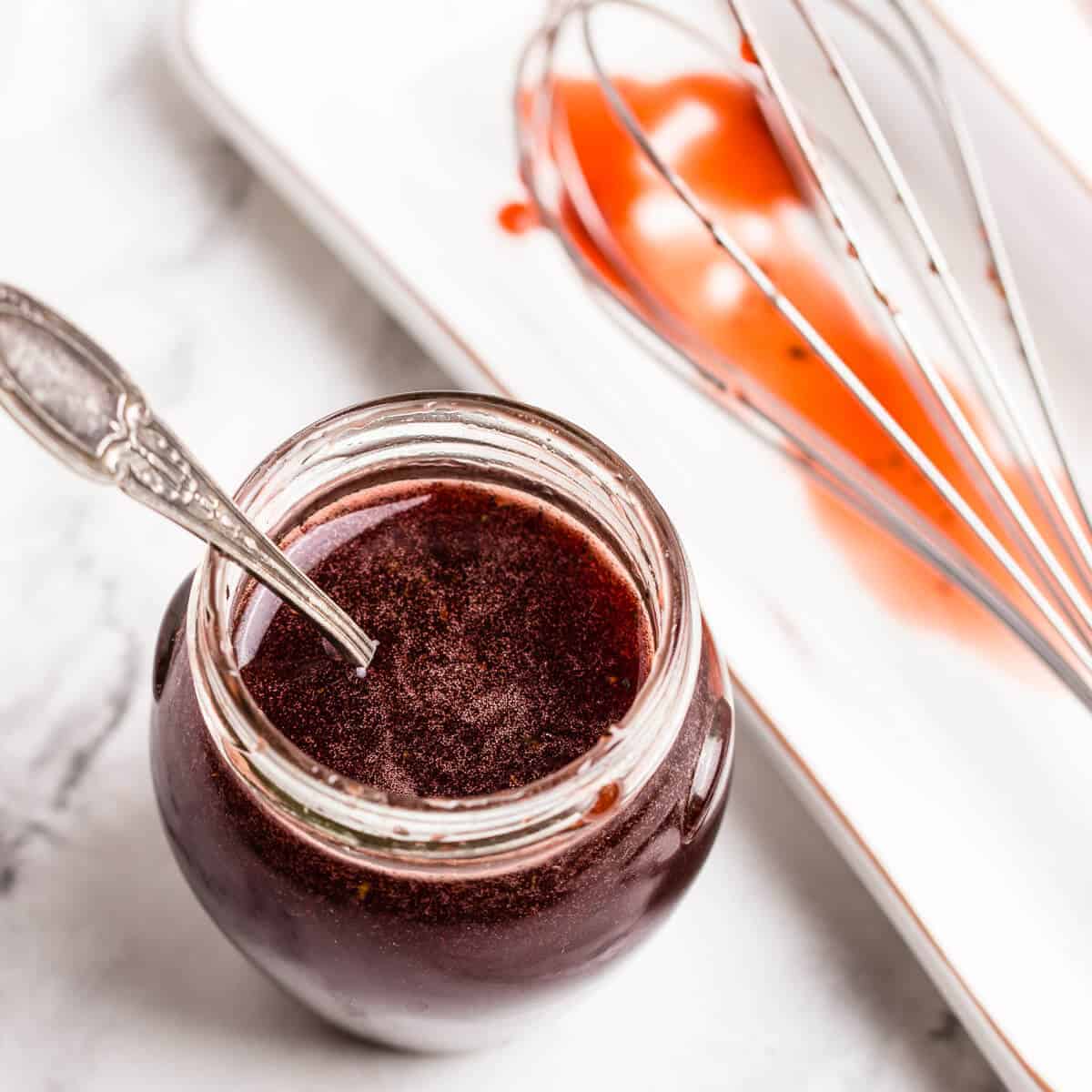 pomegranate dressing in a glass jar 