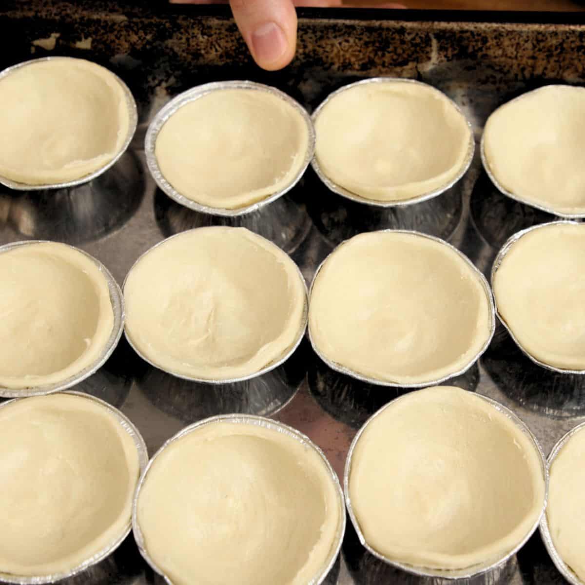 Pastry tart cases unbaked.