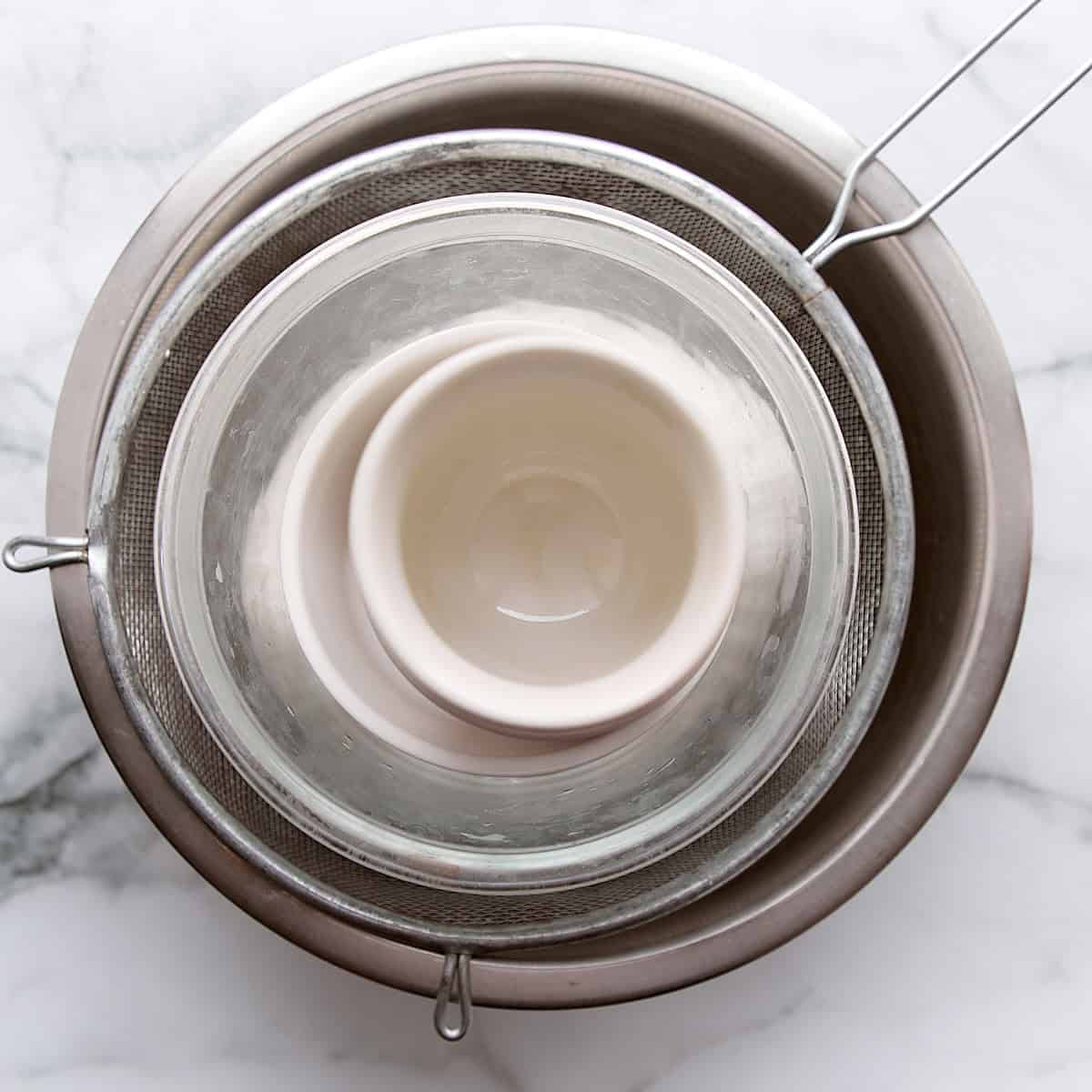 Cheese curds pressing in a bowl.