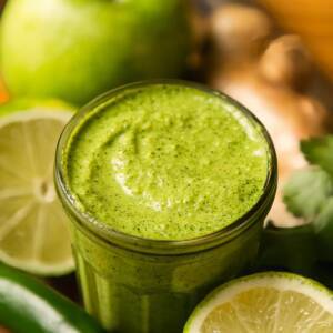 Cilantro mint chutney in a glass jar.