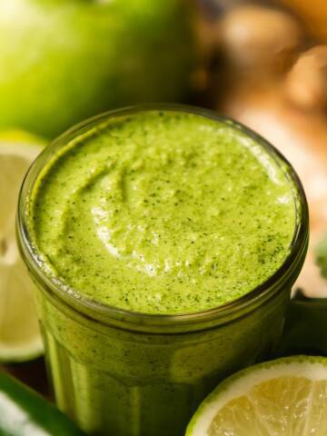 Cilantro mint chutney in a glass jar.