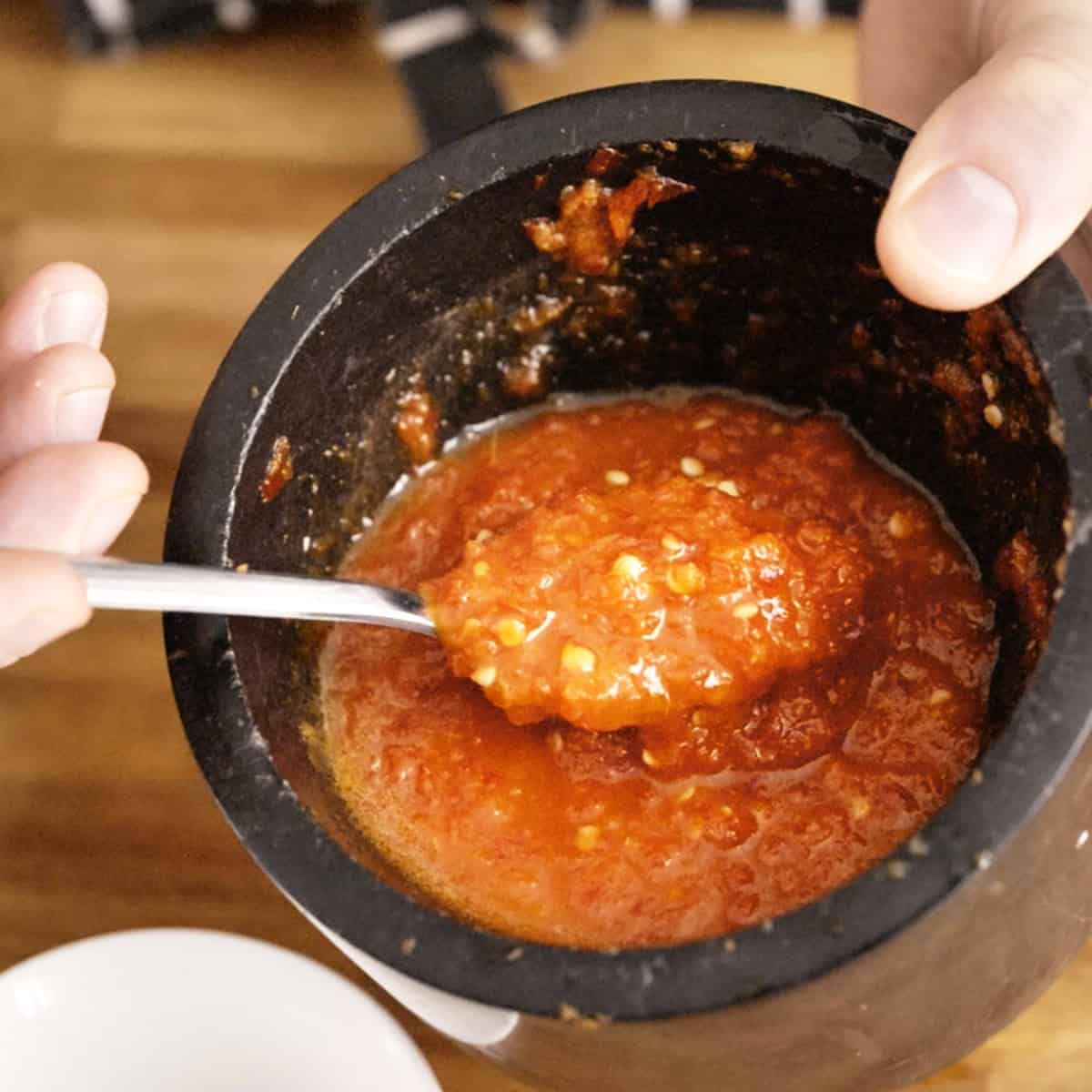 Chili ginger sauce in a pestle and mortar.