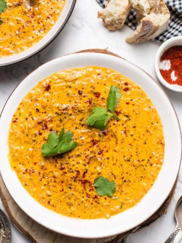 red lentil soup in white bowl