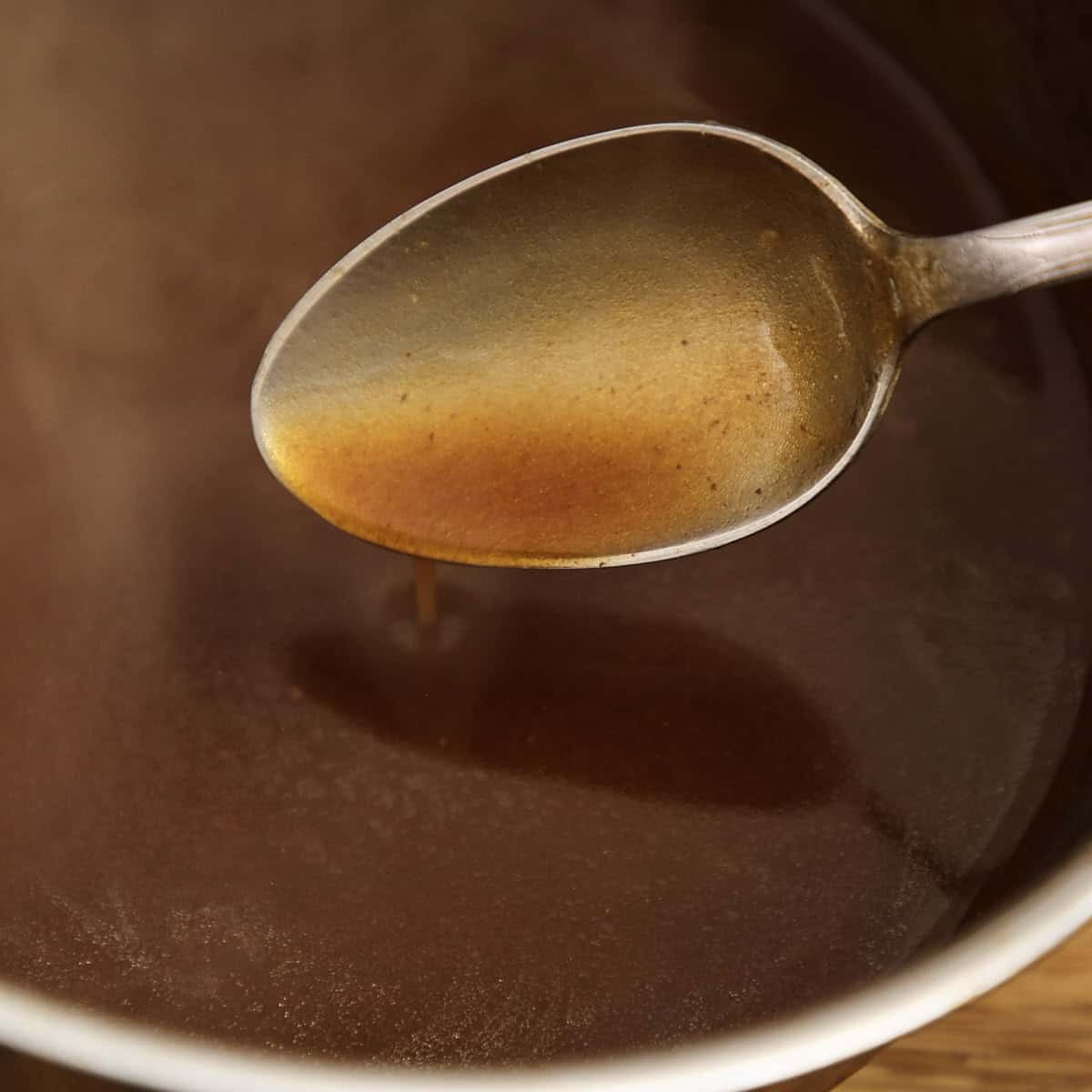 Thickened and seasoned red wine gravy made from braising liquid.