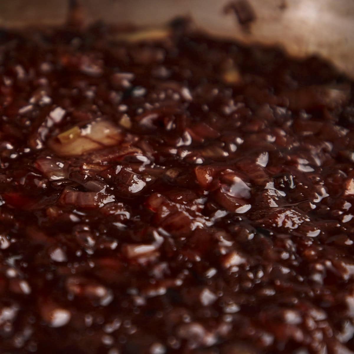 Reduced red wine and onions.