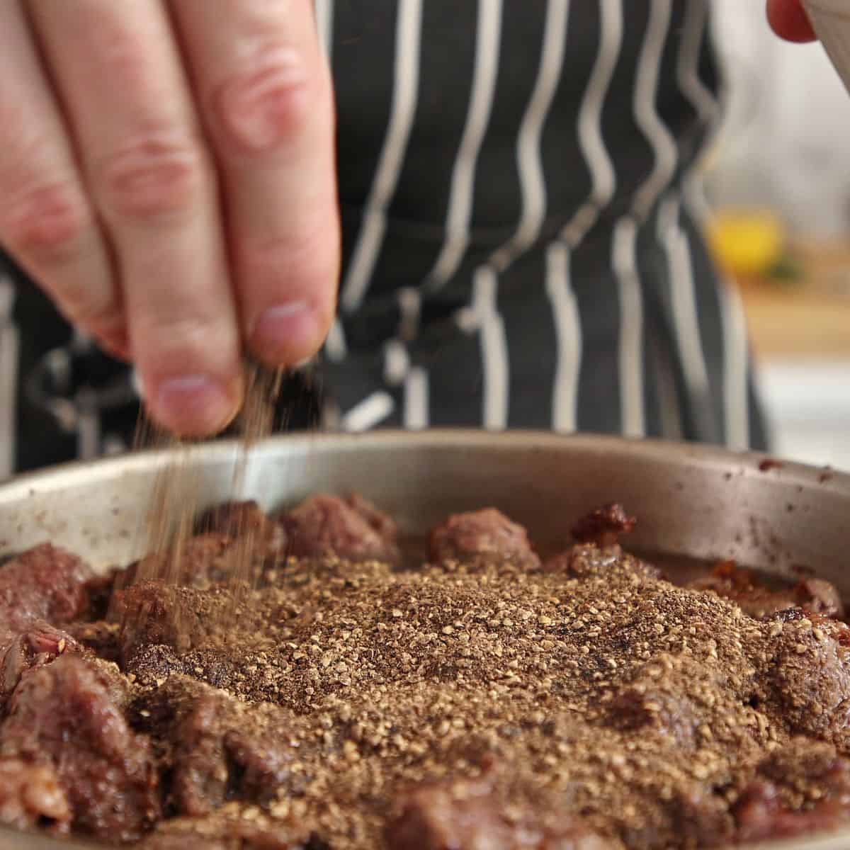 returning beef to pan and adding other ingredients