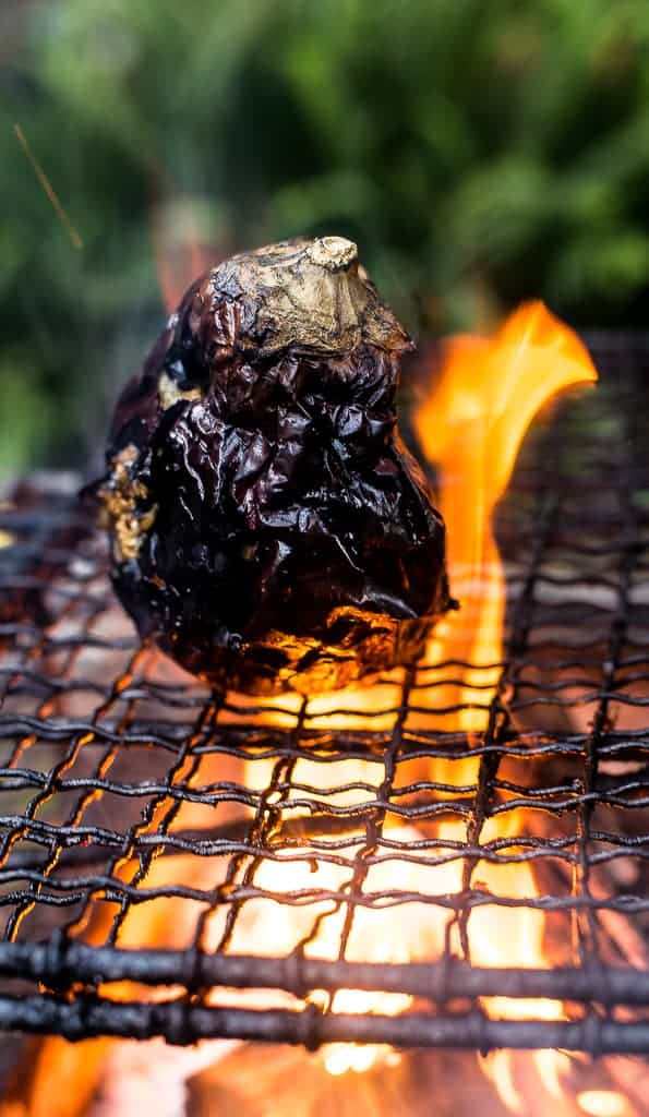 Aubergine cooking over the fire - Braai salads and side dishes