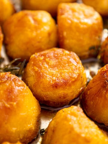 Roasted potatoes on a baking sheet.