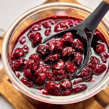Sour cherry jam in a glass jar.