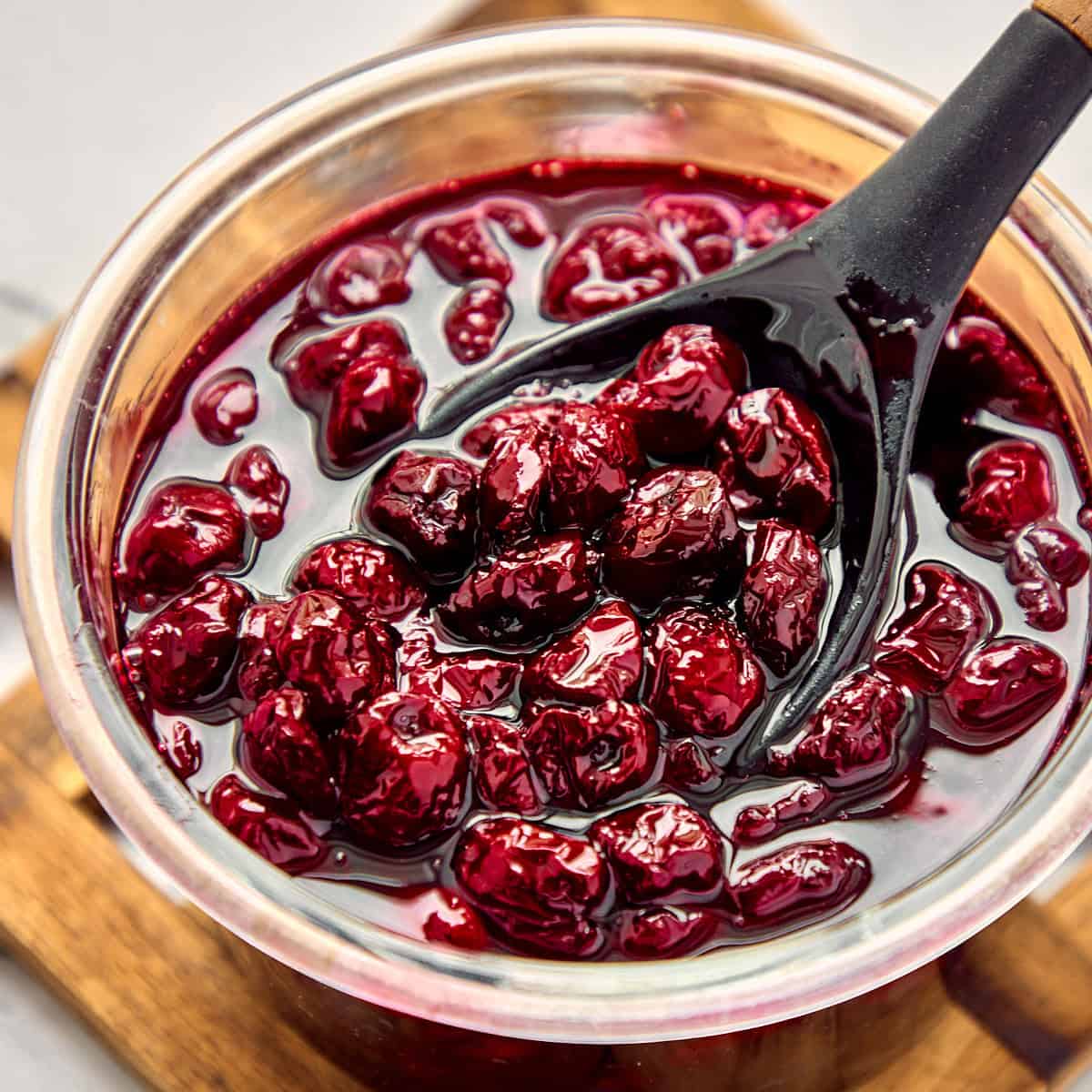 Sour cherry jam in a glass jar.