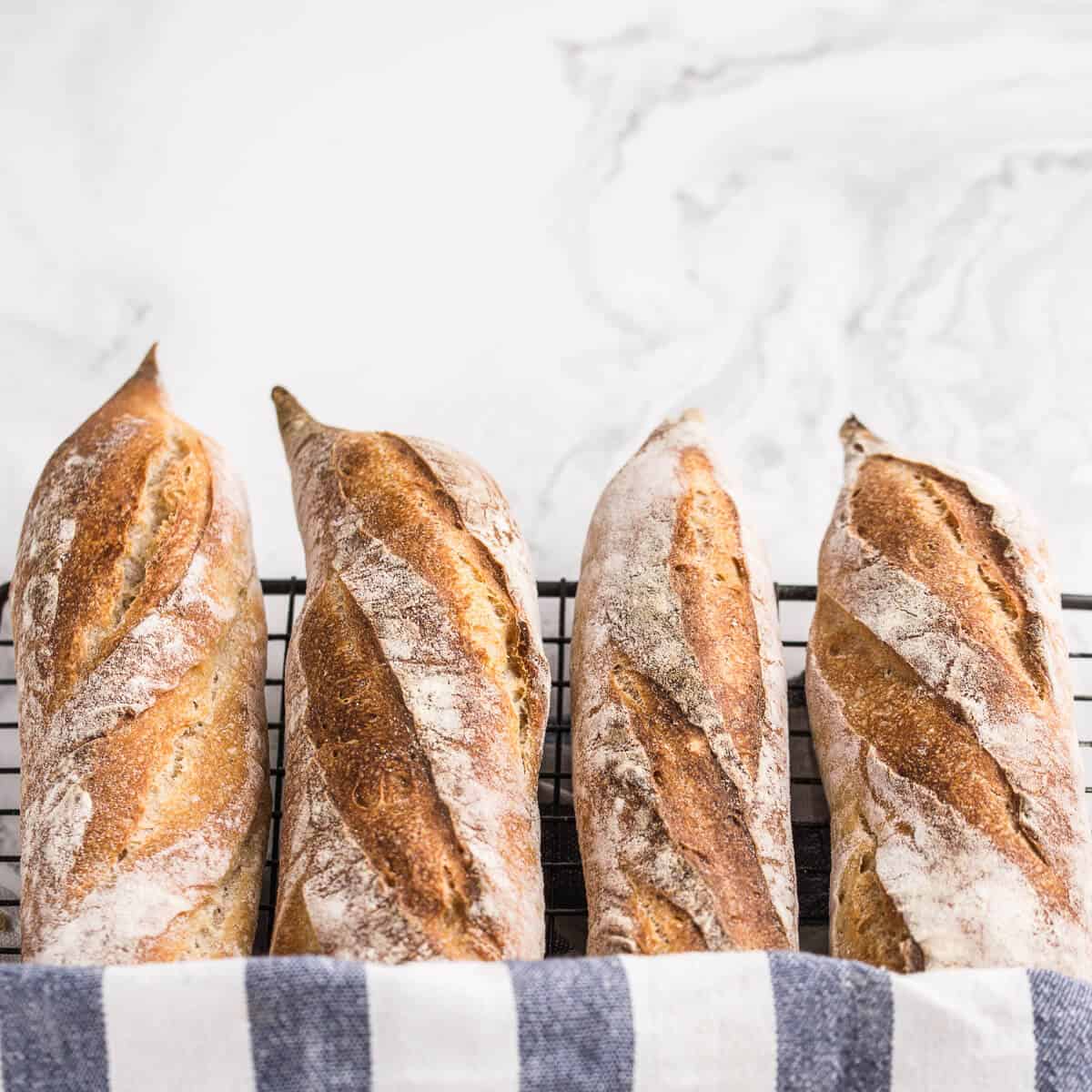 four baguettes on wire rack