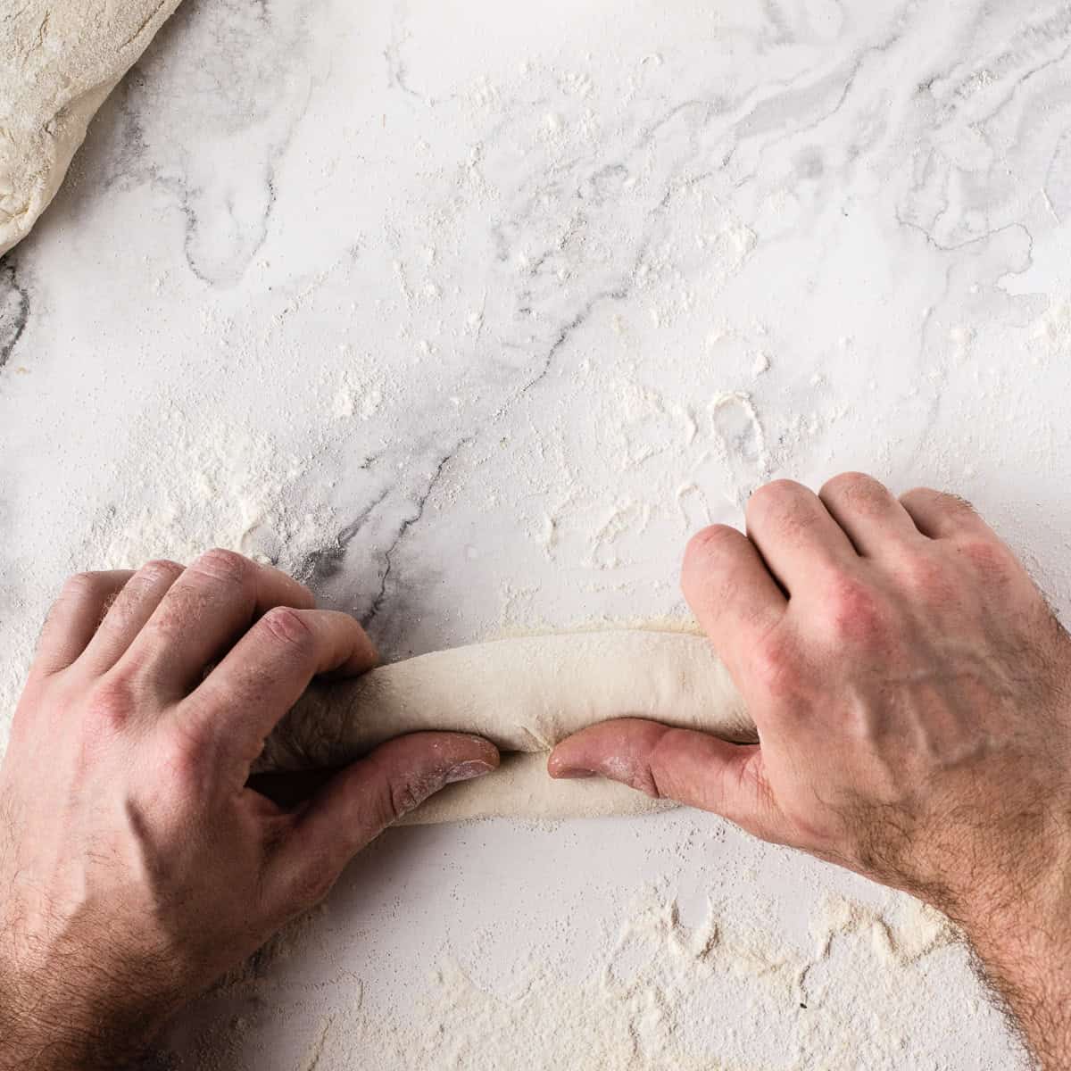 2nd fold of baguette shaping.