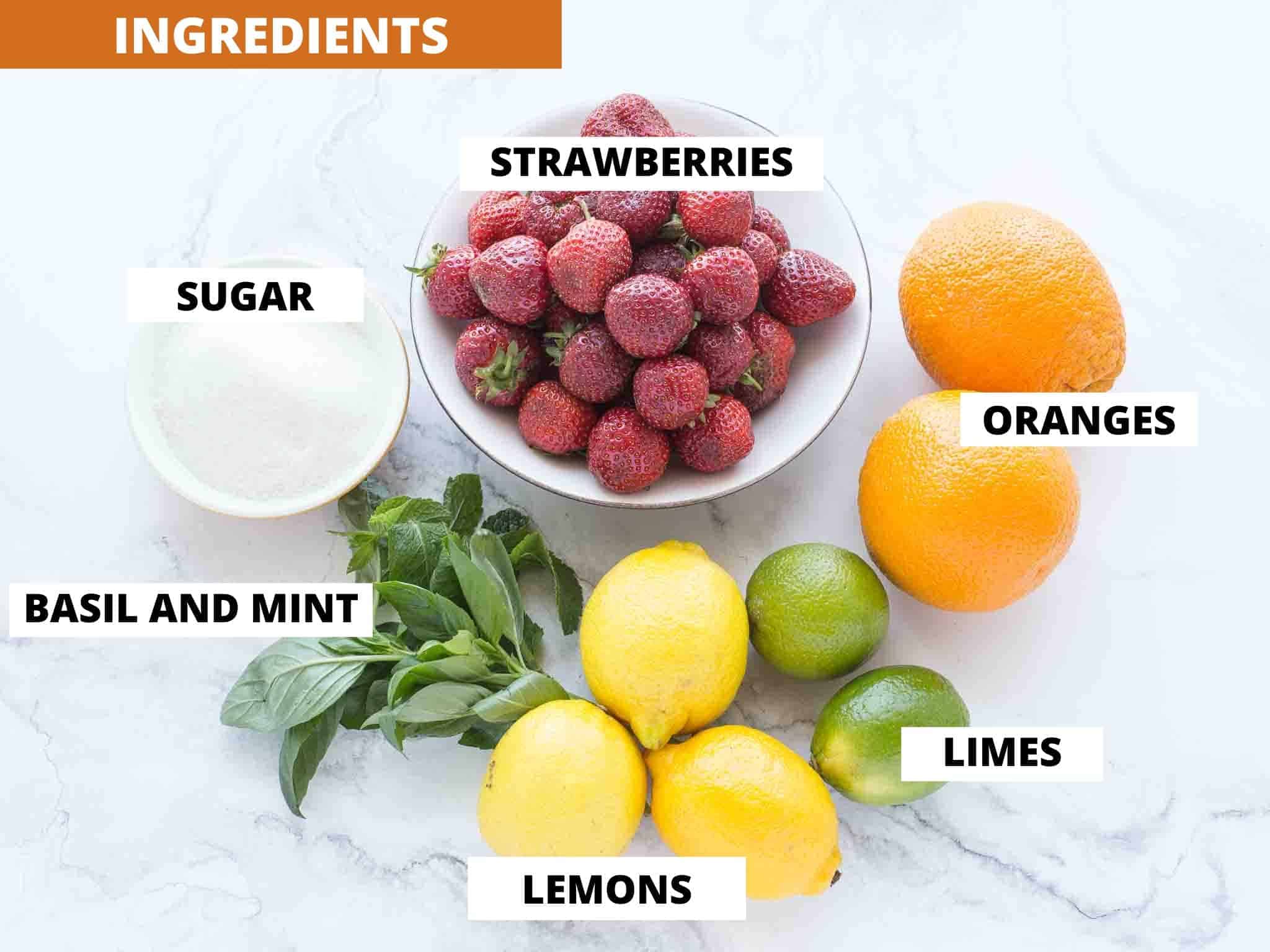 ingredients for strawberry lemonade on marbled background.