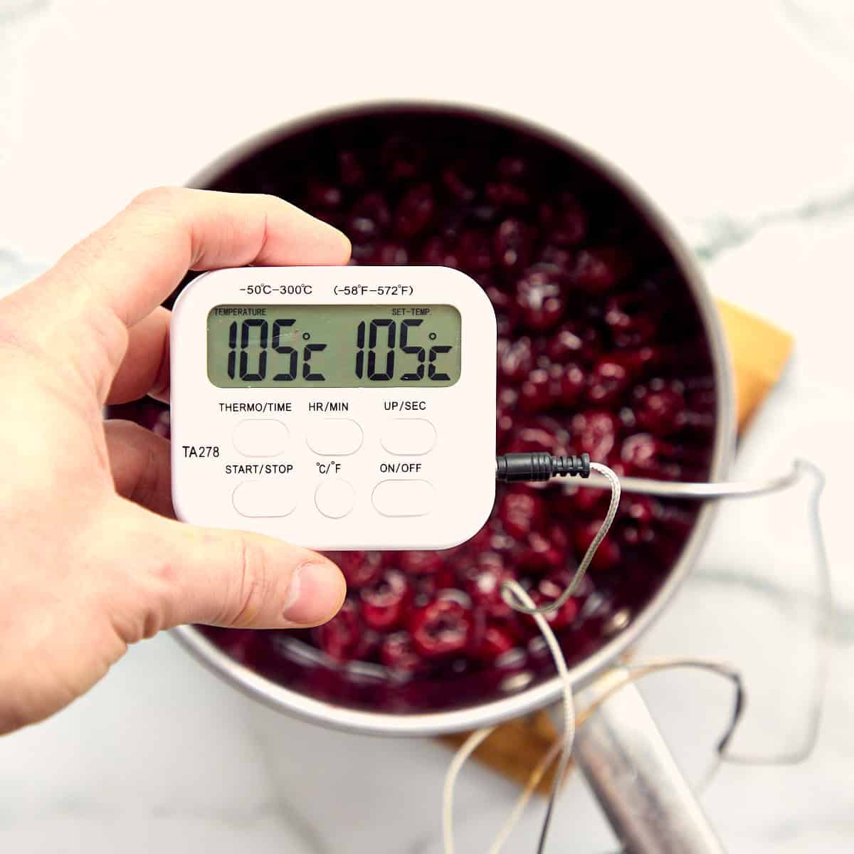 Kitchen thermometer showing the temperature.