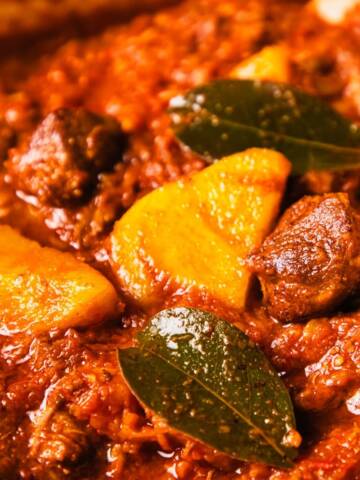 Traditional South African Tomato bredie in a casserole pan.