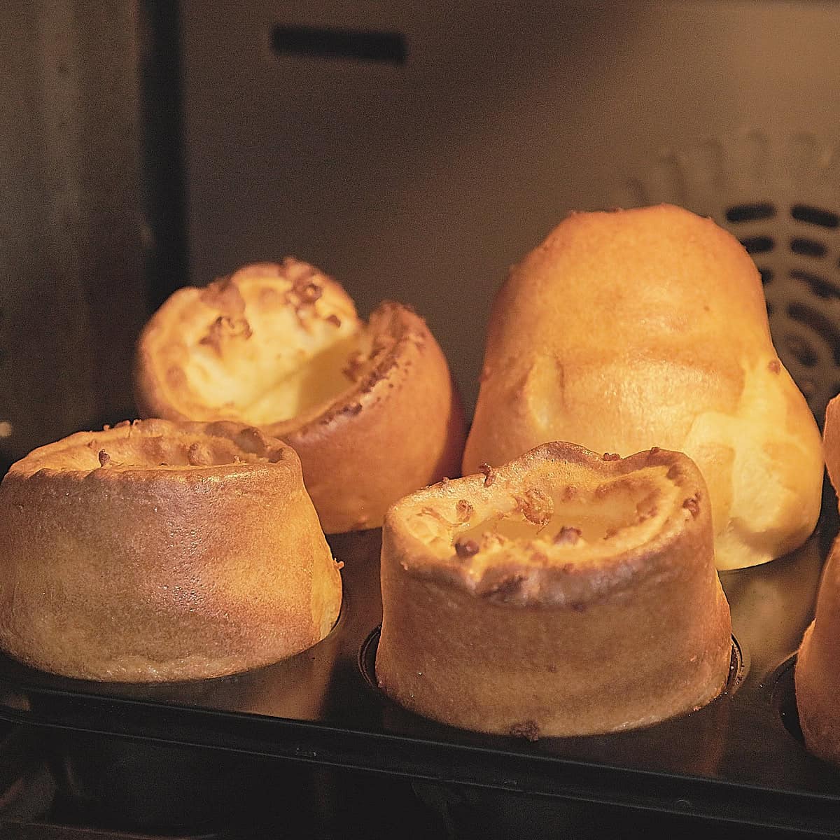 Baking Yorkshire puddings in the oven.